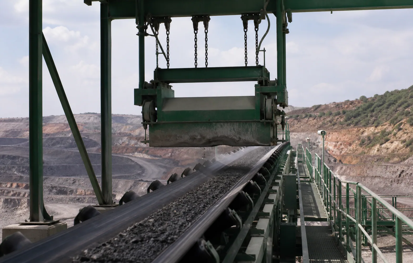 Conveyor iron-removal process context